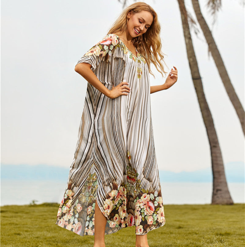Women's beach dress with floral design and airy sleeves Ivyshape