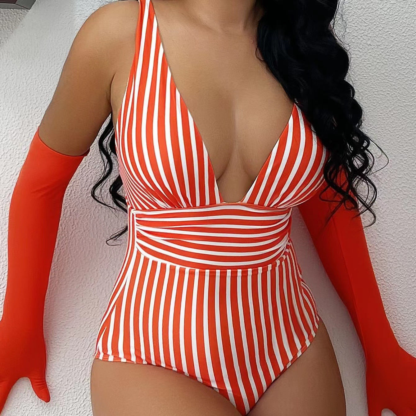 Women's one-piece swimsuit with deep V-neckline and elegant striped pattern Ivyshape