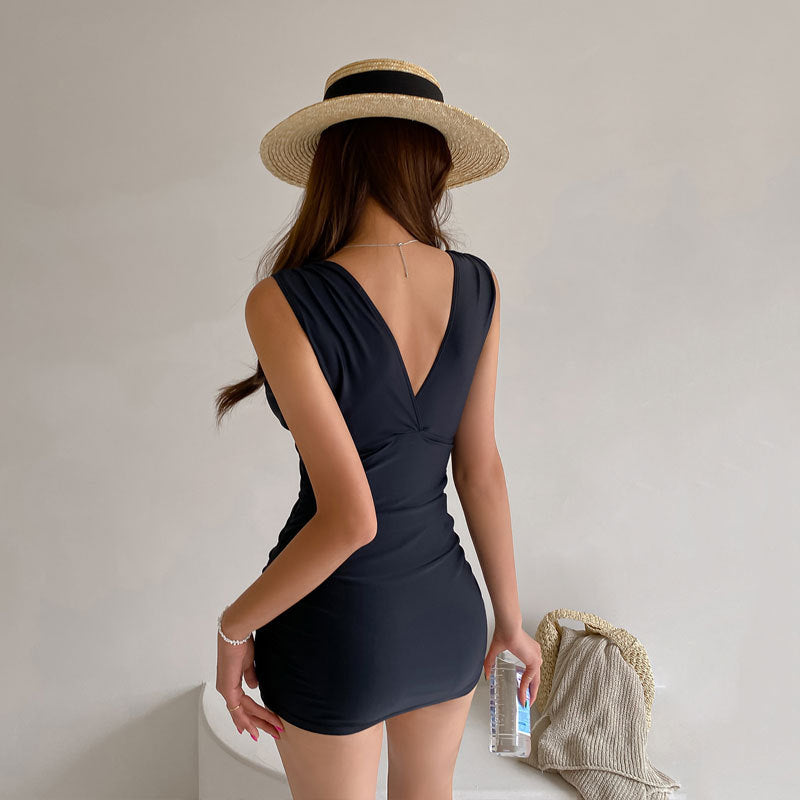 Ladies stylish swimming dress with deep V-neck and figure-flattering silhouette Ivyshape