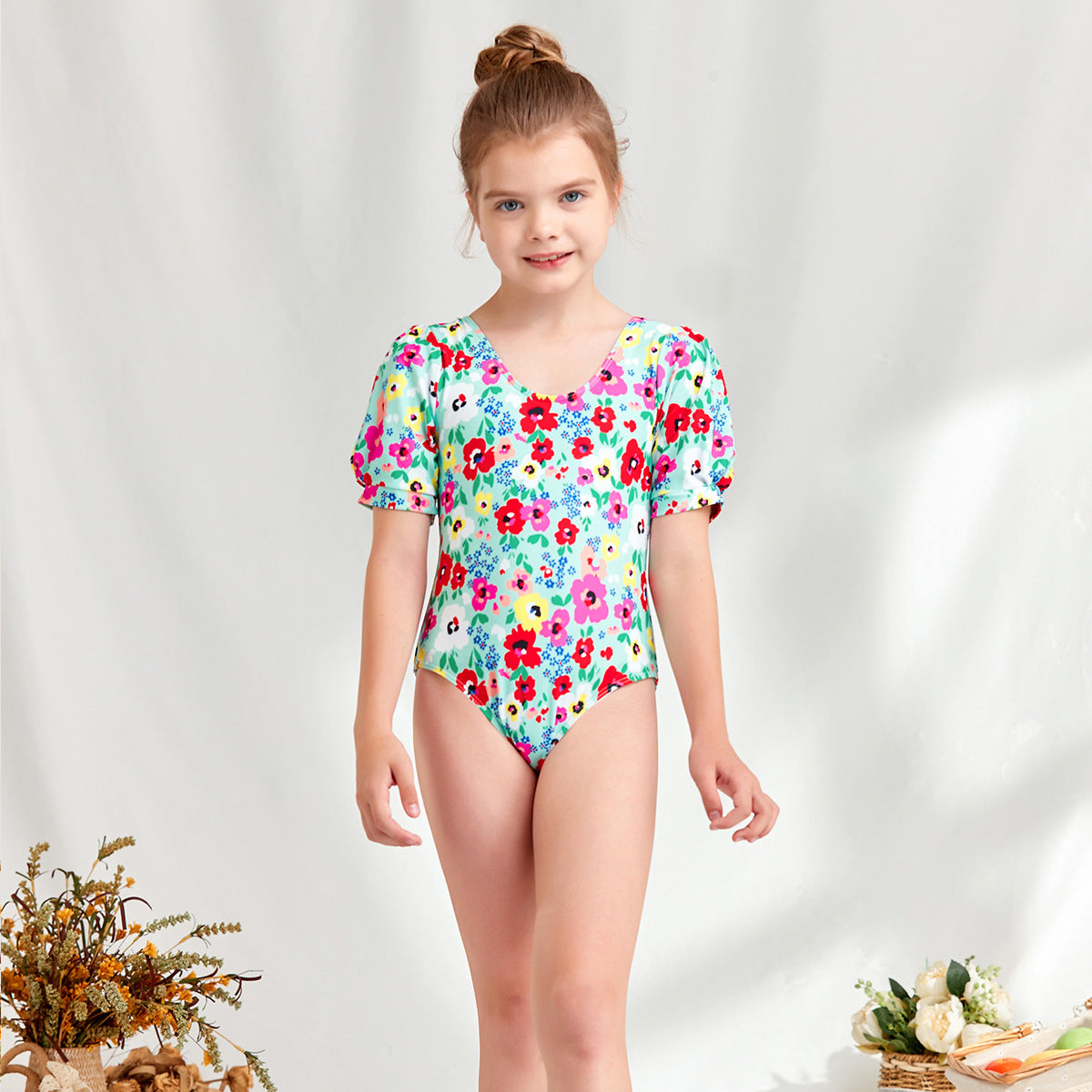 Girl's one-piece swimsuit with puff sleeves and floral design Ivyshape