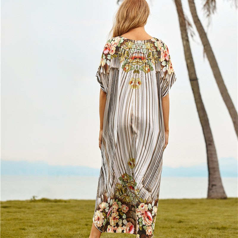 Women's beach dress with floral design and airy sleeves Ivyshape