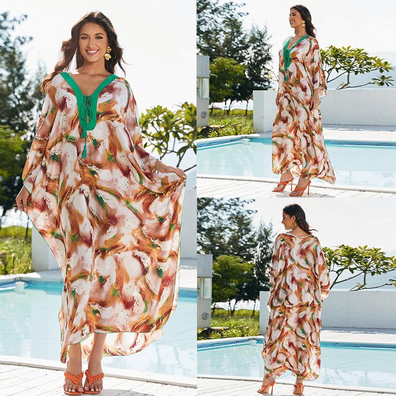Women's beach kaftan with elegant floral design and wide silhouette Ivyshape