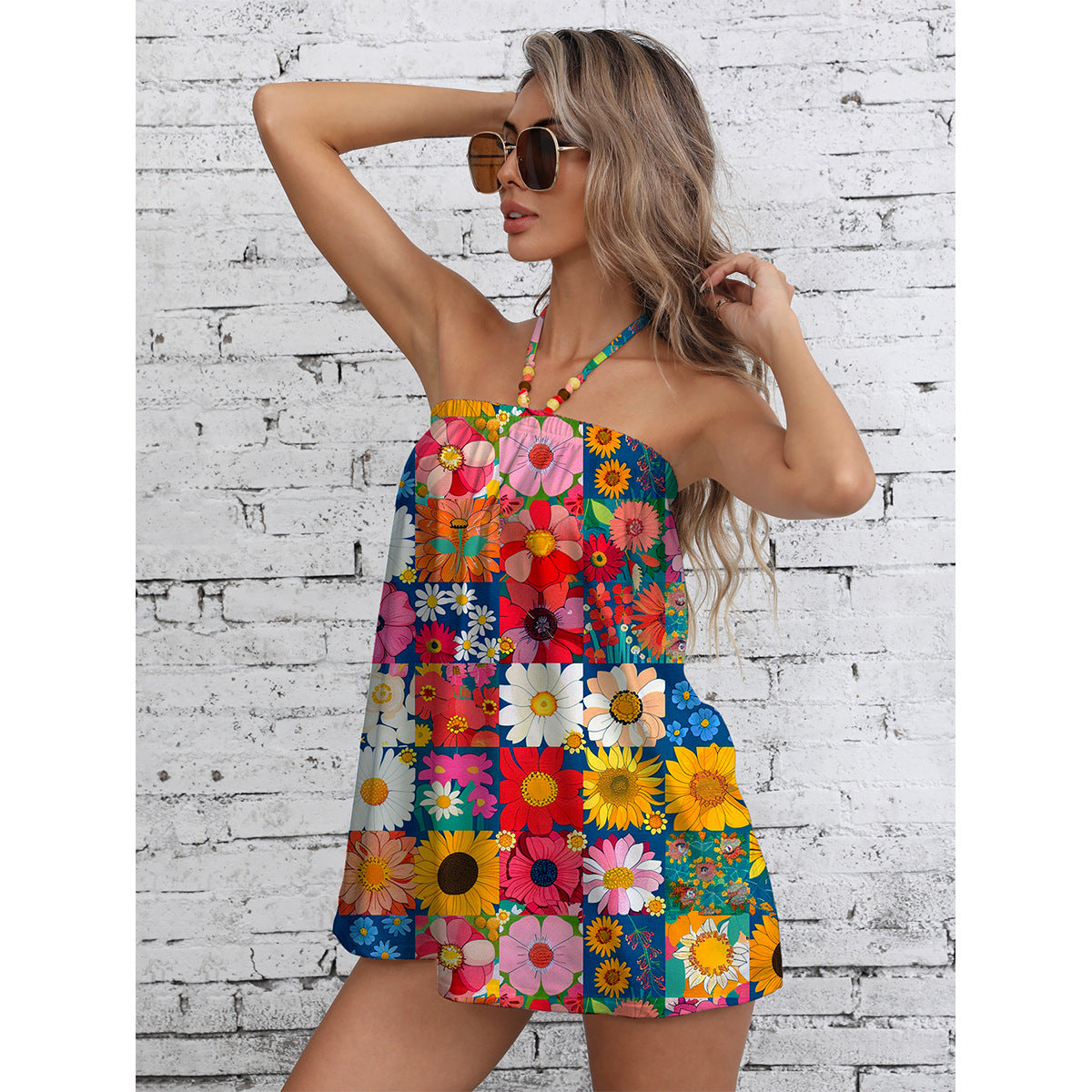 Ladies summer jumpsuit with colorful floral pattern and stylish strap design Ivyshape