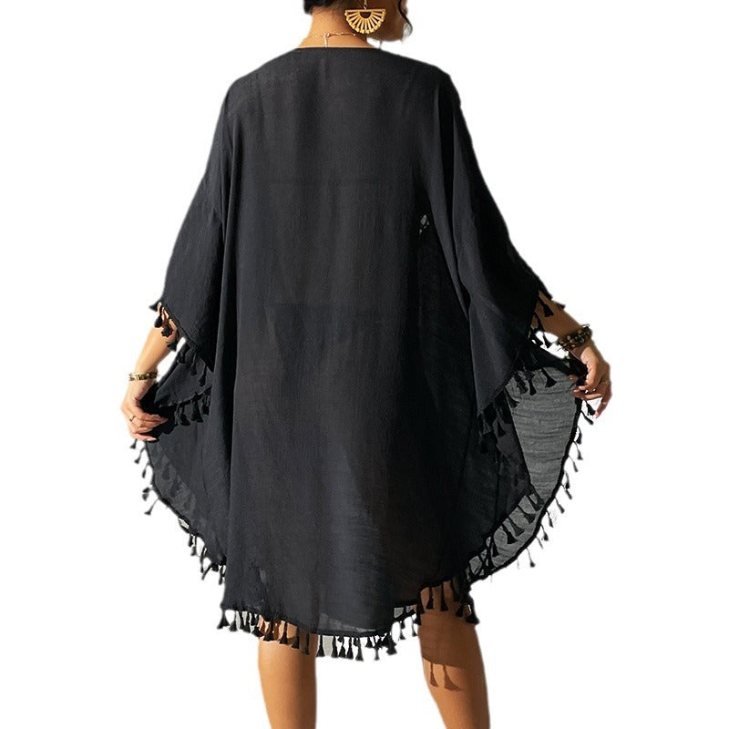 Women's lightweight beach cover-up with intricate crochet accents and fringe details Ivyshape