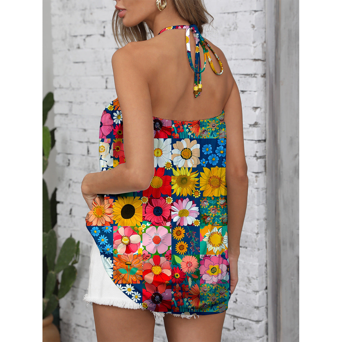 Ladies summer jumpsuit with colorful floral pattern and stylish strap design Ivyshape