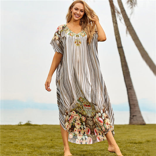 Women's beach dress with floral design and airy sleeves Ivyshape