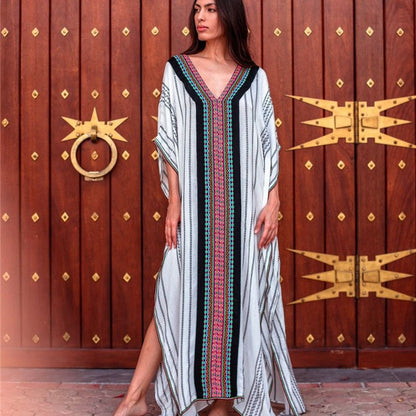 Women's beach dress with elaborate V-neck and colorful pattern Ivyshape