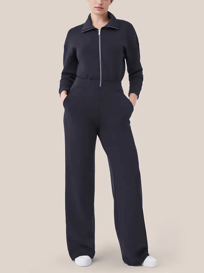 Women's sporty jumpsuit with high collar and practical pockets Ivyshape