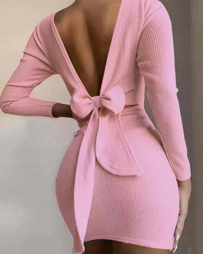 Women fitted mini dress with deep V-neck and bow detail Ivyshape