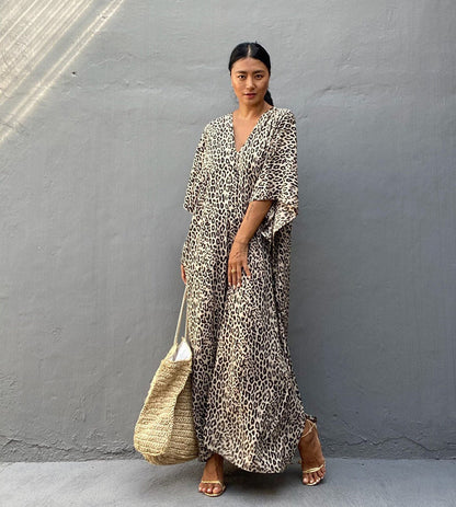 Women’s maxi dress with asymmetrical cut and animal print Ivyshape