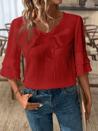 Women V-neck blouse with ruffle details and textured fabric Ivyshape