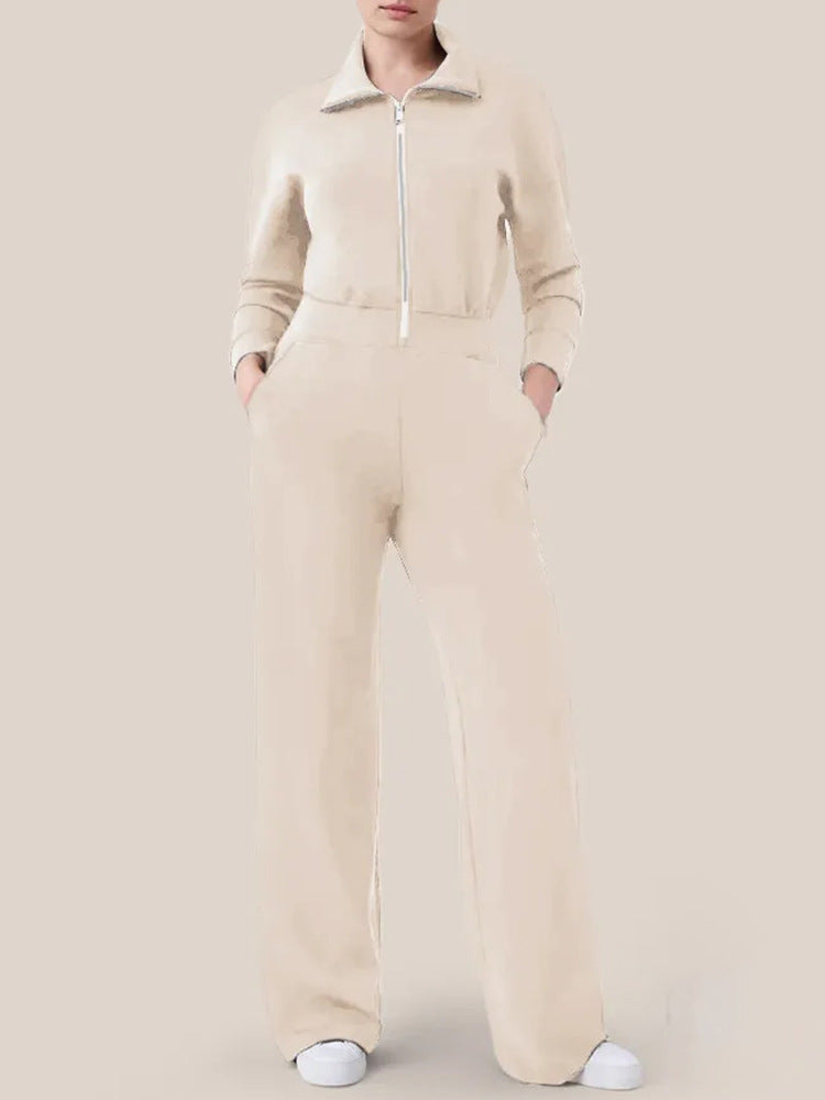 Women's sporty jumpsuit with high collar and practical pockets Ivyshape