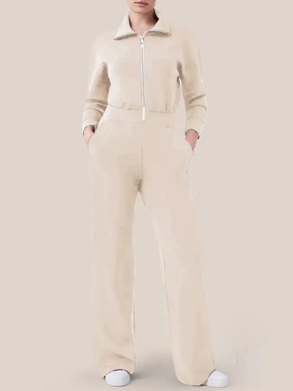 Women's sporty jumpsuit with high collar and practical pockets Ivyshape