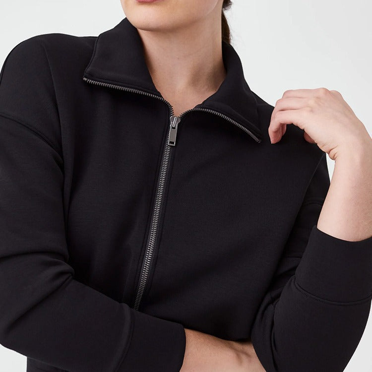 Women's sporty jumpsuit with high collar and practical pockets Ivyshape