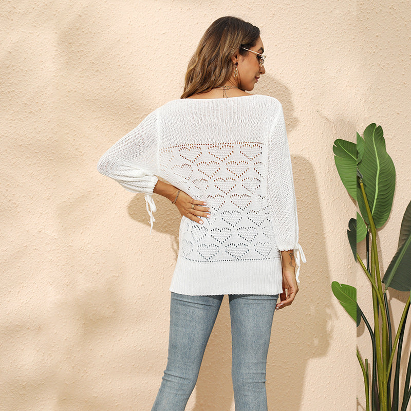 Ladies knit top with heart-shaped hole pattern and playful sleeves Ivyshape