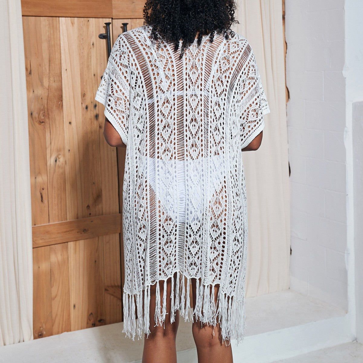 Women's crochet beach cover-up with fringed details and delicate pattern Ivyshape