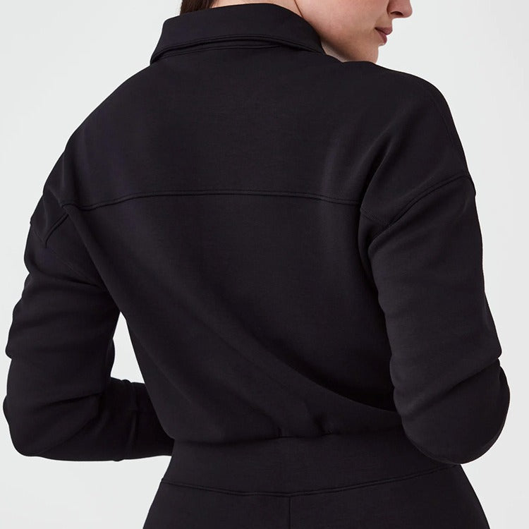 Women's sporty jumpsuit with high collar and practical pockets Ivyshape