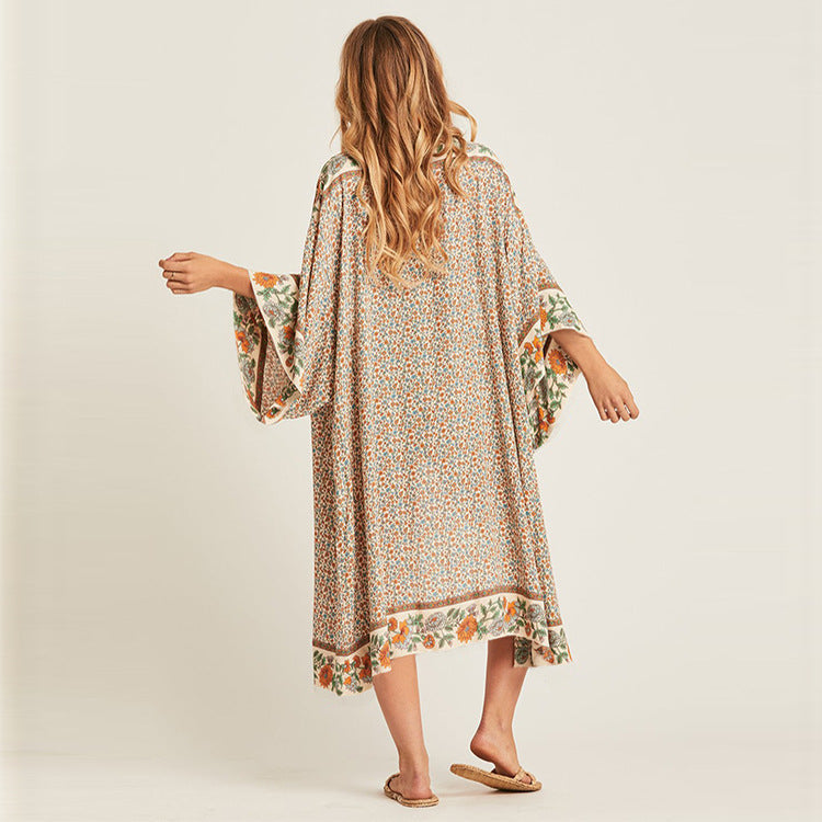 Women's beach robe with colorful floral pattern and elegant cut Ivyshape