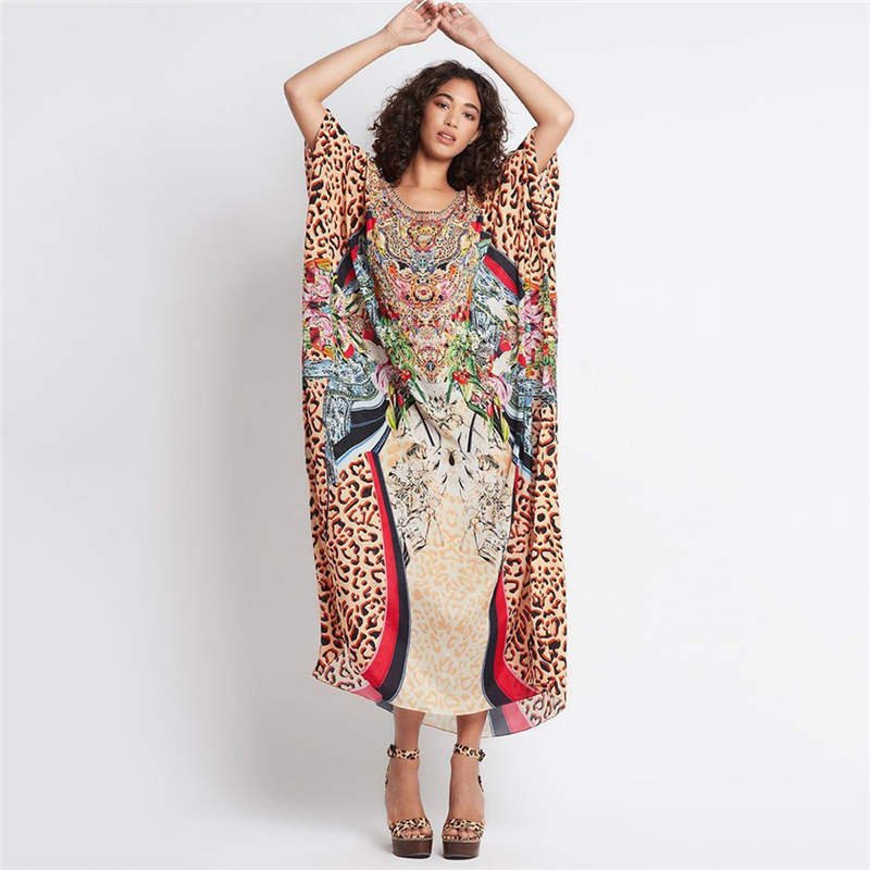 Ladies beach dress in stylish animal print and elegant accents Ivyshape
