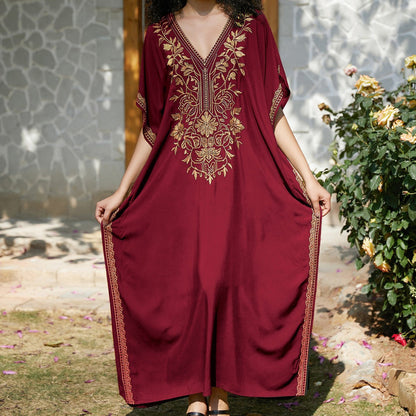 Women's kaftan dress with intricate golden border and elegant V-neck Ivyshape