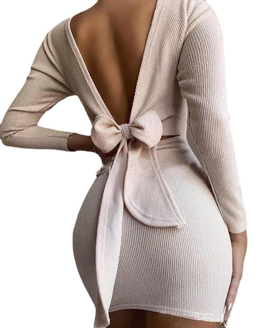 Women fitted mini dress with deep V-neck and bow detail Ivyshape